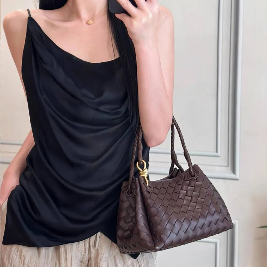 Dense Grid Woven Sloped Tote With Braided Twisted Top Handles, Knotted Golden Central Clasp And Extra Single Hanging Strap
